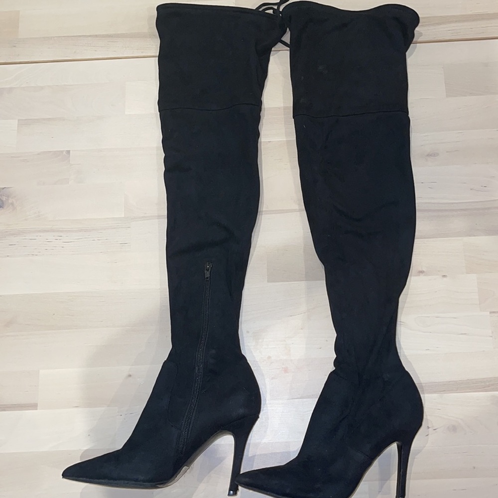 Thigh high heeled boots